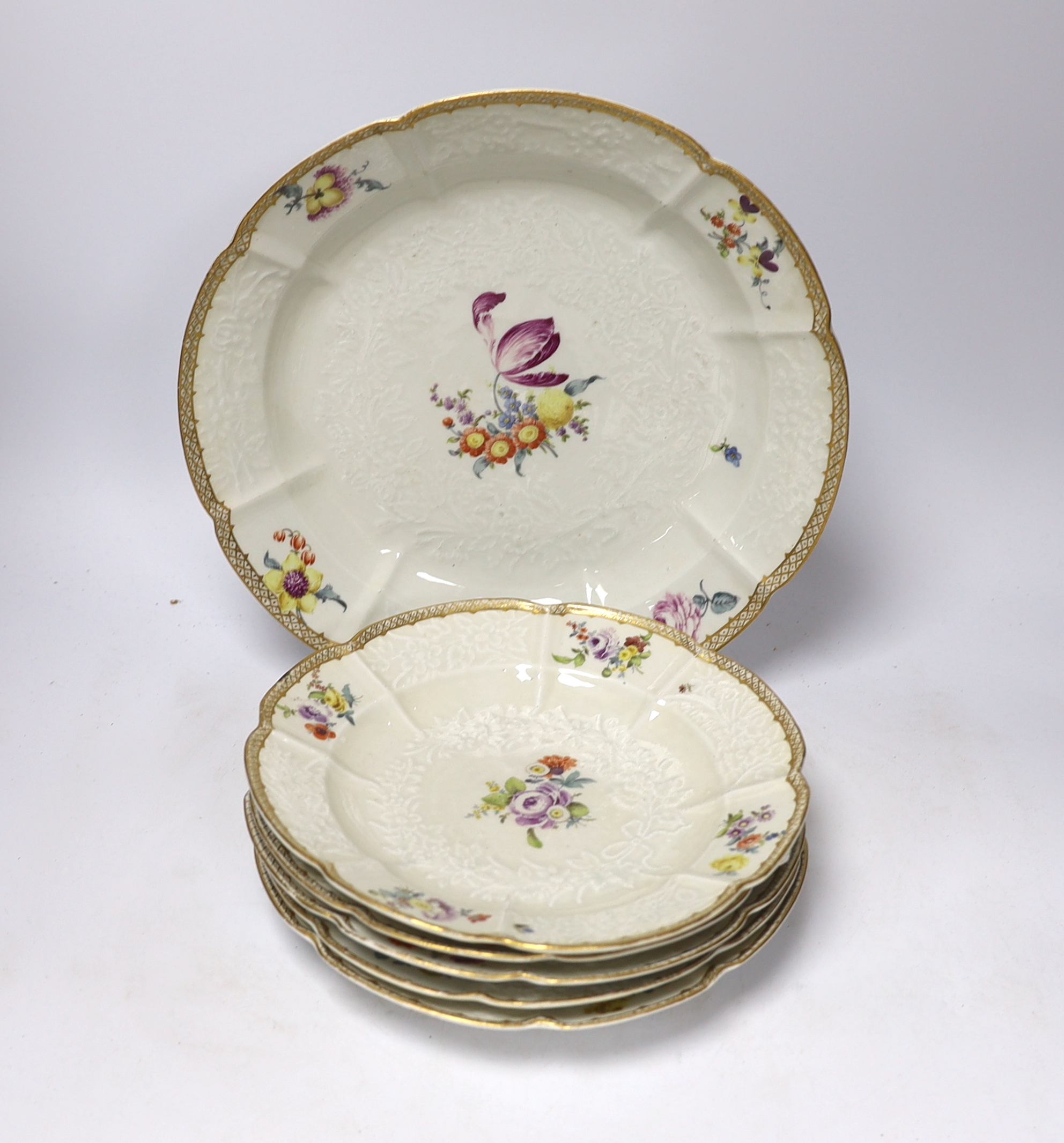 A large Meissen moulded porcelain dish and five matching plates, c.1760-70, each painted with Deutsche Blumen, dish 32cm diameter